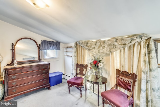 sitting room with light carpet, a baseboard heating unit, and lofted ceiling