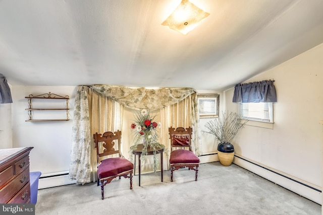 sitting room with light carpet and baseboard heating