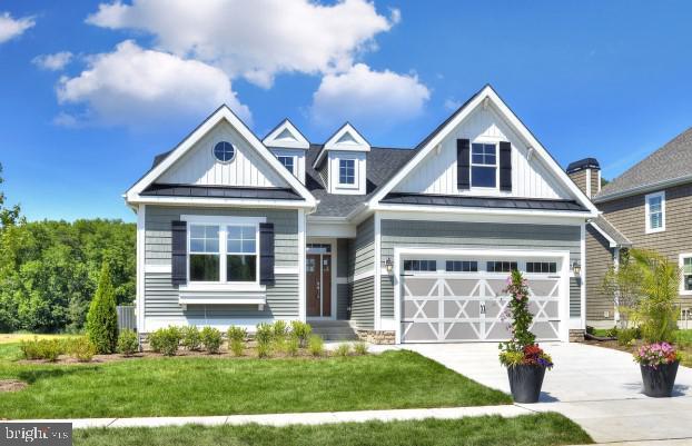 21802 Eastbridge Loop, Lewes, DE 19958 - craftsman-style house featuring a front lawn and a garage