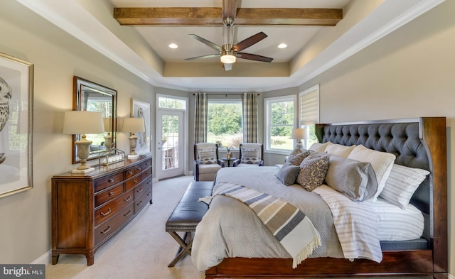 bedroom with a tray ceiling, access to exterior, ceiling fan, beamed ceiling, and light colored carpet