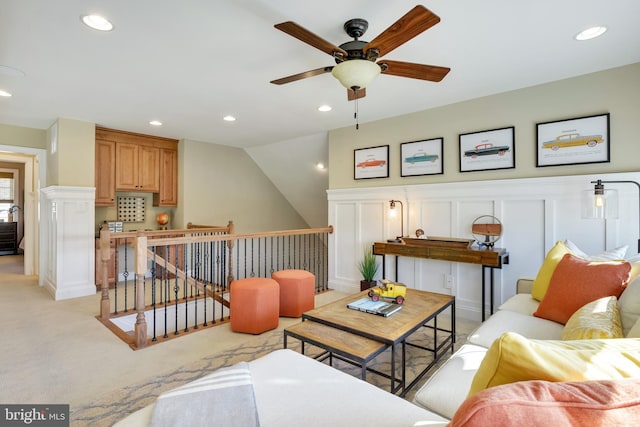 living room featuring ceiling fan and light colored carpet