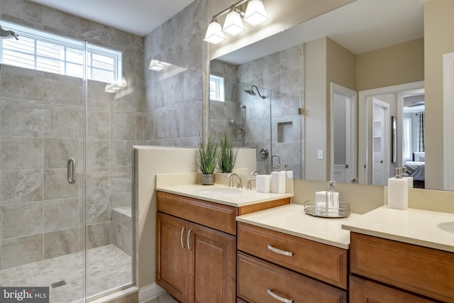 bathroom featuring oversized vanity and walk in shower