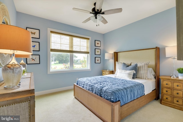 bedroom with light colored carpet and ceiling fan