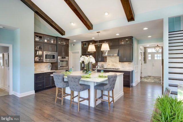 kitchen featuring dark hardwood / wood-style flooring, dark brown cabinetry, and stainless steel appliances