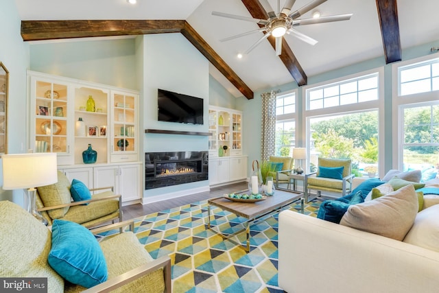 living room featuring ceiling fan, beam ceiling, high vaulted ceiling, and dark wood-type flooring