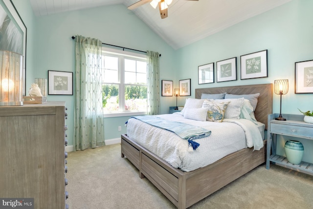 carpeted bedroom featuring ceiling fan and lofted ceiling