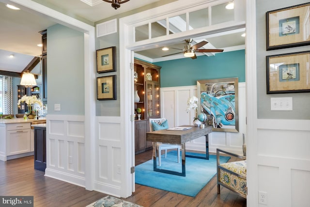 mudroom featuring ornamental molding, ceiling fan, and dark hardwood / wood-style flooring