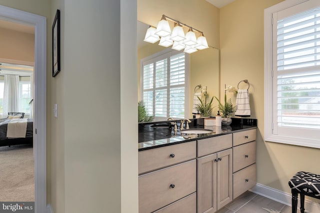 bathroom with tile flooring and vanity