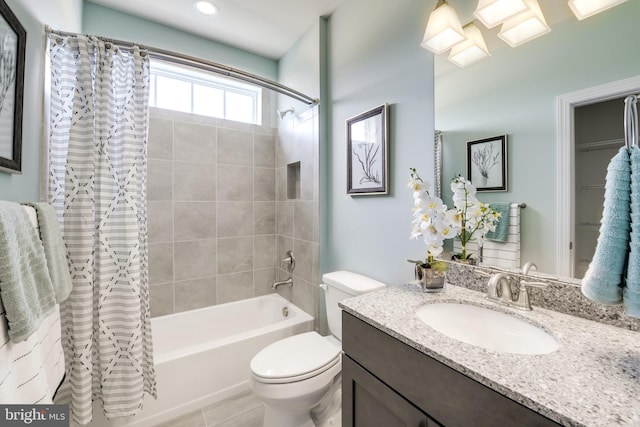 full bathroom featuring tile flooring, toilet, oversized vanity, and shower / tub combo with curtain