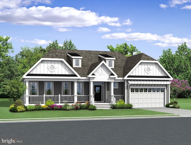 view of front of property featuring a front lawn, covered porch, and a garage