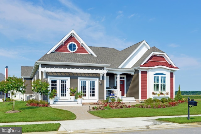 view of front of home featuring a front lawn and covered porch