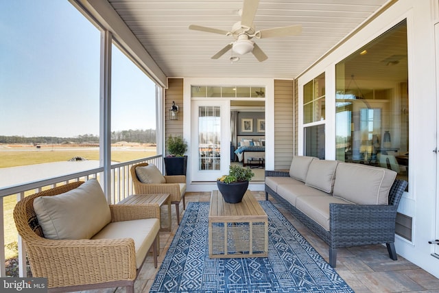 sunroom / solarium with ceiling fan