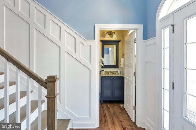 corridor featuring dark hardwood / wood-style floors and sink