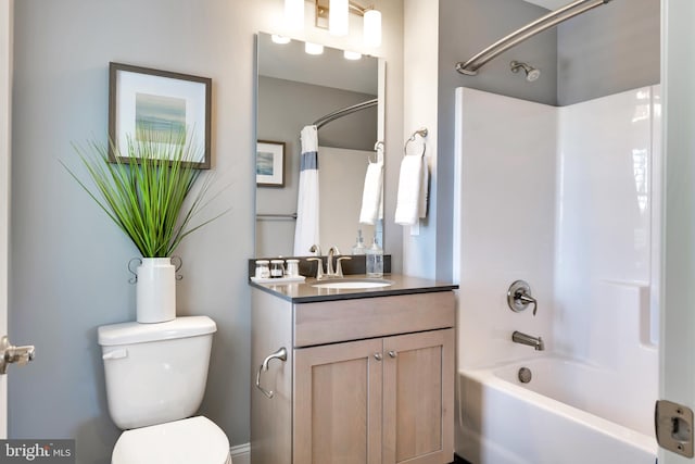 full bathroom featuring shower / bath combination with curtain, toilet, and vanity