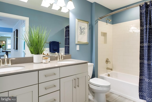 full bathroom featuring shower / bath combination with curtain, tile flooring, double vanity, and toilet