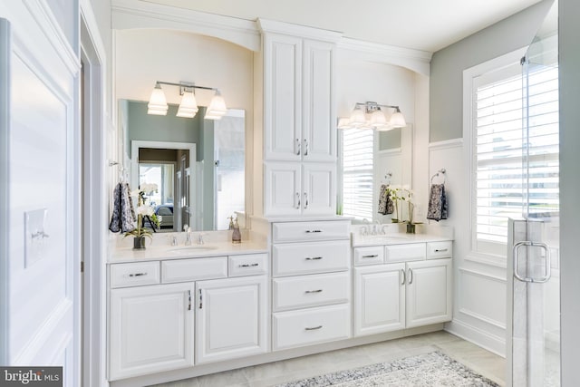 bathroom featuring double sink vanity and tile floors