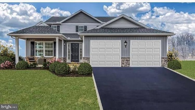 view of front of house with a front lawn and a garage