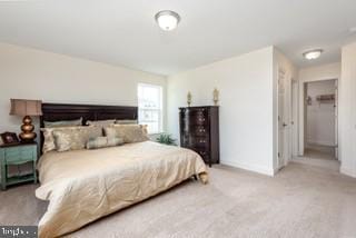 bedroom with light colored carpet