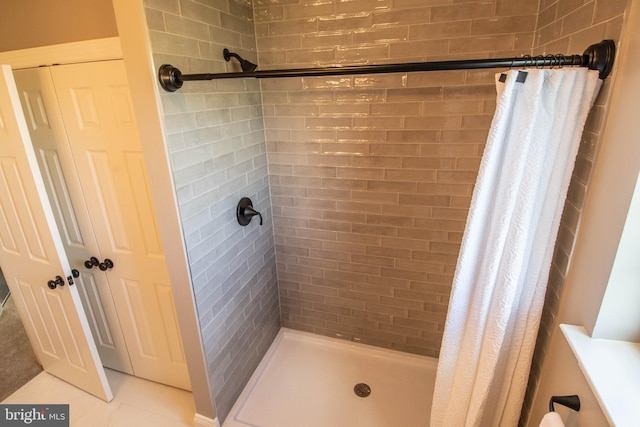 bathroom featuring tile floors and walk in shower