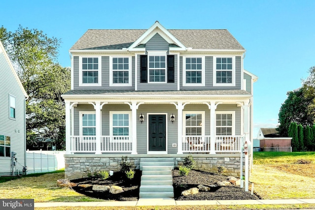 colonial-style house featuring a porch