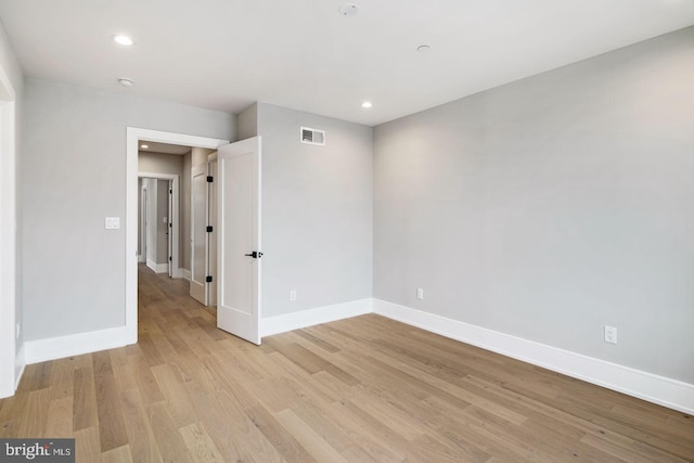 spare room featuring light hardwood / wood-style floors