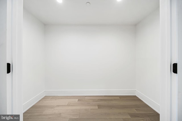 unfurnished room with light hardwood / wood-style floors