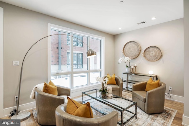 sitting room with light hardwood / wood-style flooring