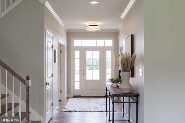 entrance foyer featuring hardwood / wood-style floors and ornamental molding