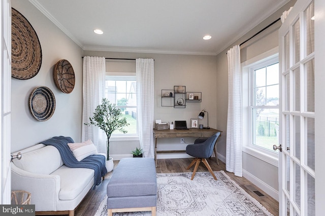 home office featuring ornamental molding, a wealth of natural light, hardwood / wood-style floors, and french doors