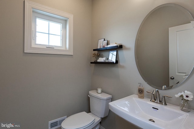 bathroom with sink and toilet