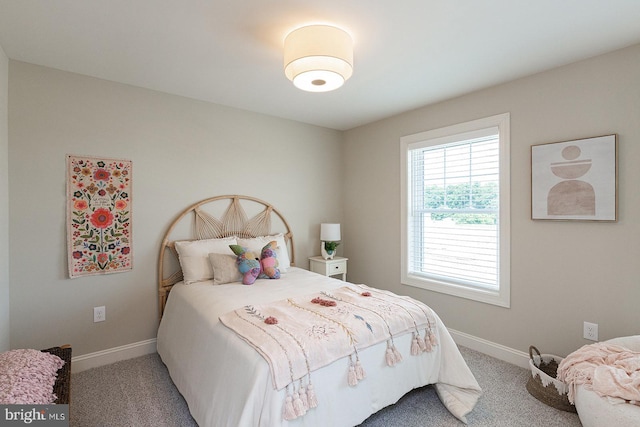 bedroom featuring light colored carpet