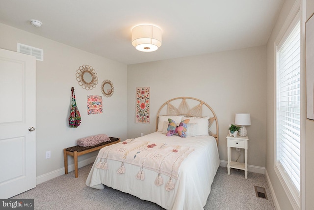 bedroom featuring light carpet