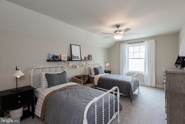 carpeted bedroom featuring lofted ceiling and ceiling fan