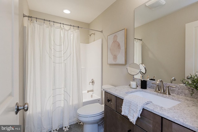 full bathroom featuring shower / bath combo, toilet, and vanity