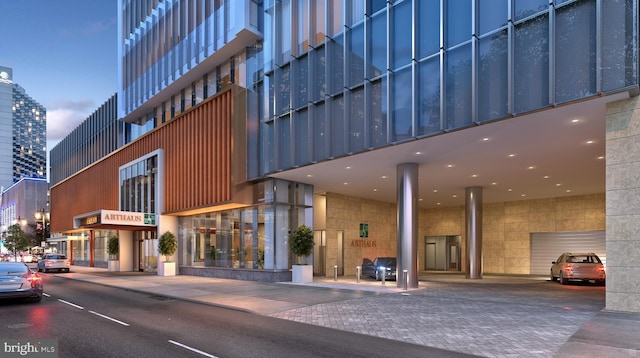 view of outdoor building at dusk