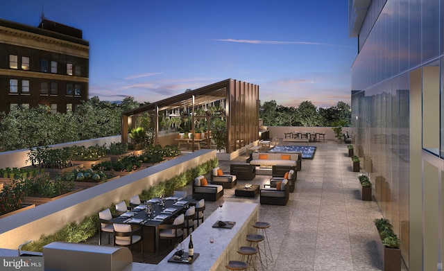 patio terrace at dusk featuring outdoor lounge area