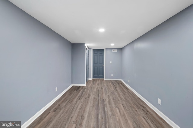 spare room with hardwood / wood-style flooring