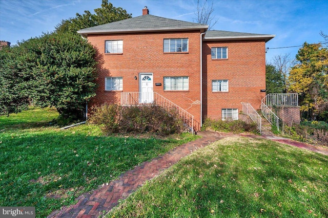 view of home's exterior featuring a lawn