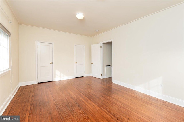 empty room featuring hardwood / wood-style flooring