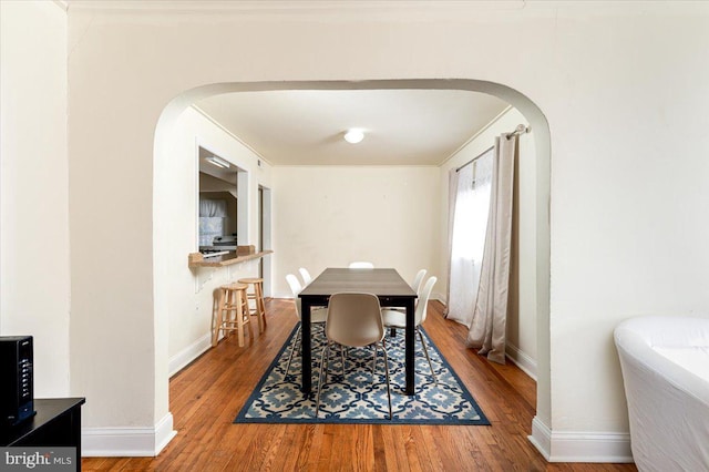 dining space with light hardwood / wood-style floors