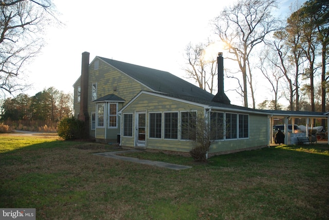 rear view of house with a lawn