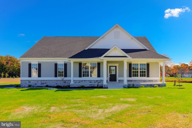 view of front of house with a front lawn and a porch