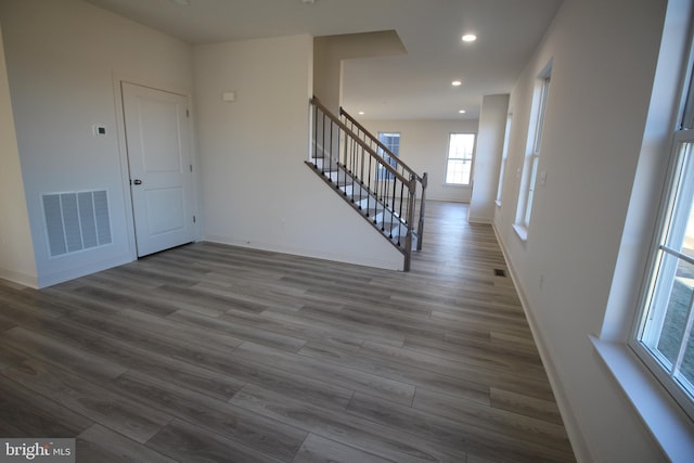 entryway with hardwood / wood-style floors