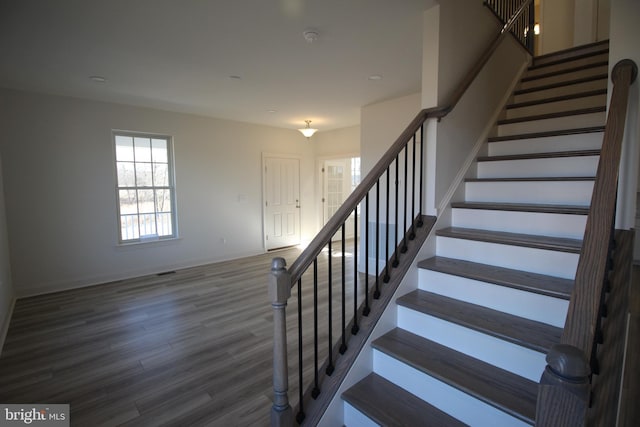 stairs with hardwood / wood-style floors