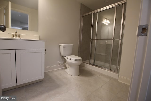 bathroom with an enclosed shower, vanity, toilet, and tile patterned flooring