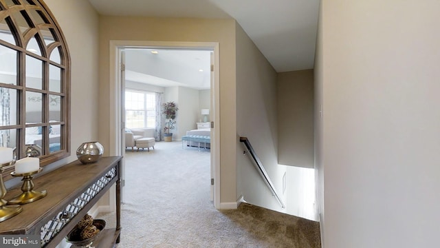 hallway with light colored carpet