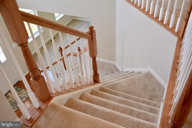 stairway with light colored carpet