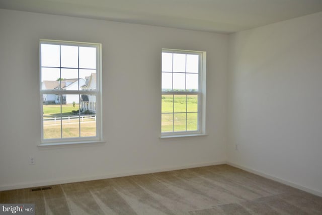 unfurnished room with carpet floors