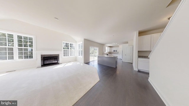 unfurnished living room with dark hardwood / wood-style flooring