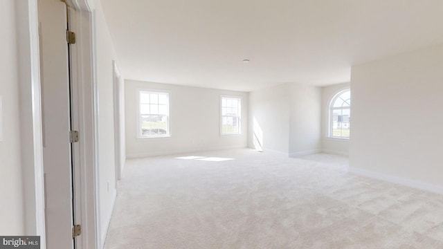 empty room featuring light colored carpet